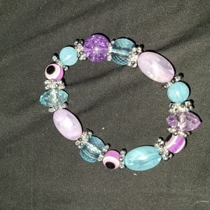 Blue and purple beaded brush